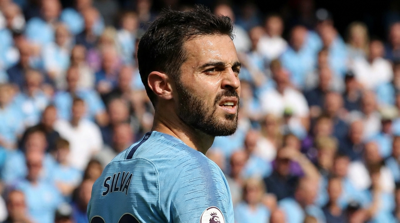 Bernardo Silva in Manchester City light blue kit looking focused on the pitch with a blurred stadium background
